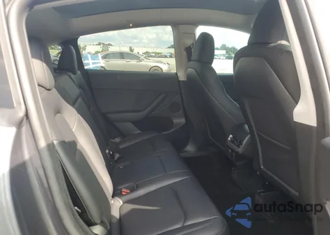 2023 Tesla Model Y from USA, damaged, VIN 7SAYGDED6PF959824